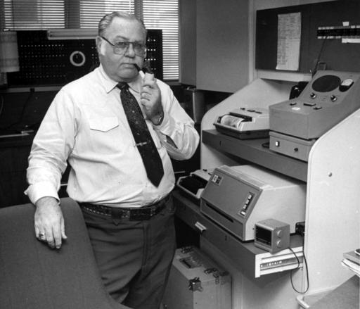 This Feb. 15, 1985 file photo shows former AP photographer Ed Kolenovsky transmitting photos at the bureau office in Houston. (AP Photo)