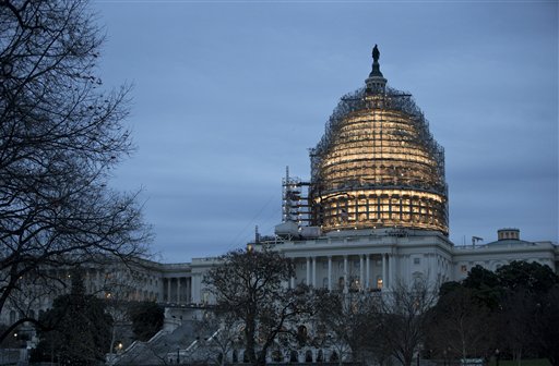 The Capitol dome is illuminated amid scaffolding for repairs in Washington, Friday morning, Dec. 18, 2015. How the nation votes and the resulting balance of power in Congress will be addressed by AP's new product for radio stations. (AP Photo/J. Scott Applewhite) 