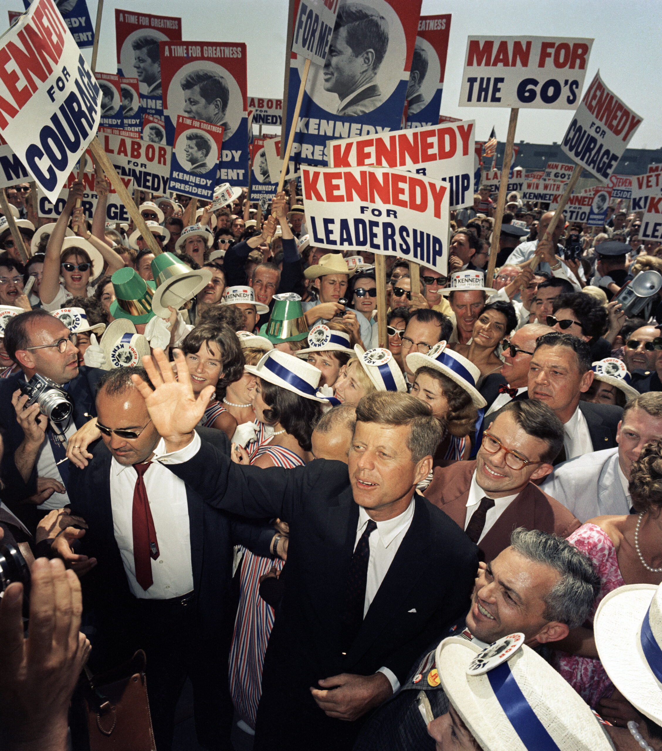 Sen. John F. Kennedy, D-Mass., makes his way through a crowd of supporters and journalists as he arrives in Los Angeles, July 9, 1960, for the Democratic National Convention, which will officially select him as the party’s nominee. (AP Photo) 