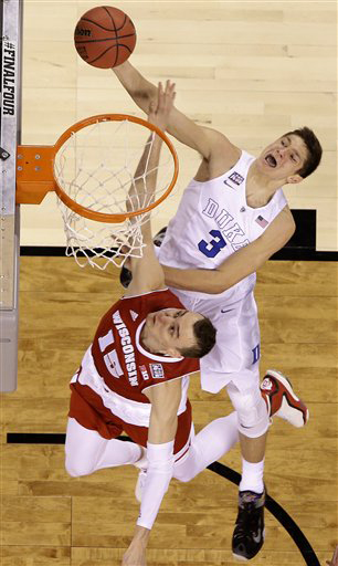 Duke's Grayson Allen (3) shoots against Wisconsin's Sam Dekker (15) during the second half of the NCAA Final Four college basketball tournament championship game Monday, April 6, 2015, in Indianapolis. (AP Photo/David J. Phillip)