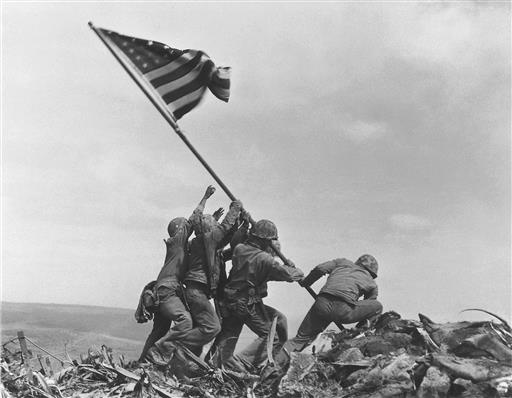 Pulitzer Prize-winning photo taken by Joe Rosenthal in 1945 shows U.S. Marines of the 28th Regiment, 5th Division, raising the American flag atop Mt. Suribachi, Iwo Jima, Japan. (AP Photo/Joe Rosenthal) 