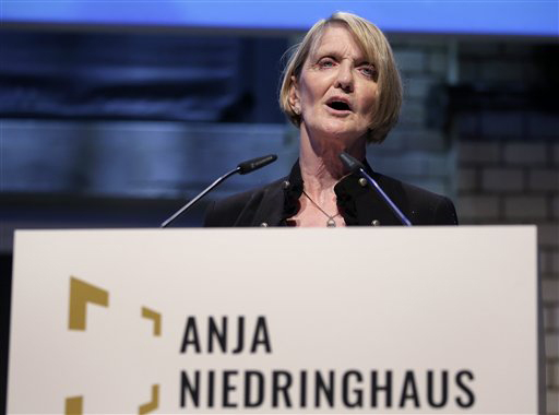 AP's special regional correspondent for Pakistan and Afghanistan, Kathy Gannon, speaks at the gathering in Berlin to present the Anja Niedringhaus Courage in Photojournalism Award to Heidi Levine. Gannon was wounded by the same gunman who killed Niedringhaus last year in Afghanistan. (AP Photo/Michael Sohn)