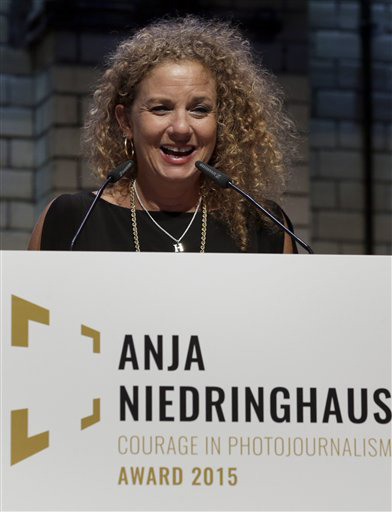 Photographer Heidi Levine, winner of the first Anja Niedringhaus Courage in Photojournalism Award, speaks during the ceremony in Berlin, Thursday, June 25, 2015. The award was created to honor the life and work of Pulitzer Prize-winning AP photographer Anja Niedringhaus (1965-2014). (AP Photo/Michael Sohn)