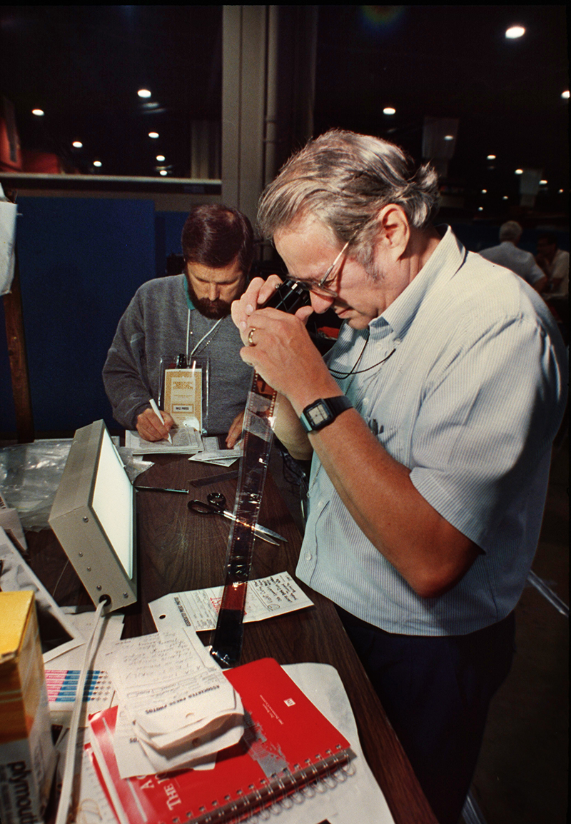 Toby Massey, right, and New York Senior Photo Editor Brian Horton handle film during the Democratic National Convention in Atlanta, 1988. (AP Photo)