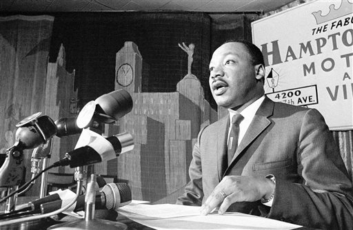 In this April 13, 1966 file photo taken by Toby Massey, Dr. Martin Luther King speaks during a press conference  in Miami on April 13, 1966. Massey, a photographer and photo editor who directed coverage of many prominent events during his 38-year career with The Associated Press, died Thursday, Aug. 21, 2014. He was 80. (AP Photo/Toby Massey)