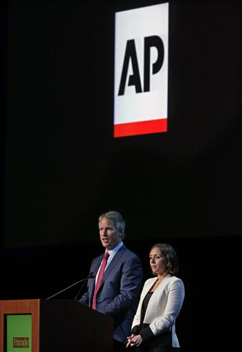  Gary Pruitt, left, president and CEO of The Associated Press, and Julie Pace, AP's chief White House correspondent, take questions after speaking to editors and publishers at the Newspaper Association of America’s mediaXchange 2014 convention in Denver, Tuesday, March 18, 2014. (AP Photo/Brennan Linsley)