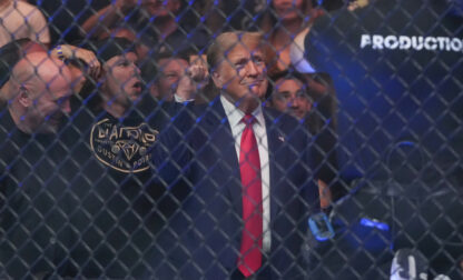 Former President Donald Trump gestures while attending the UFC 302 mixed martial arts event Saturday, June 1, 2024, in Newark, N.J. (AP Photo/Frank Franklin II)