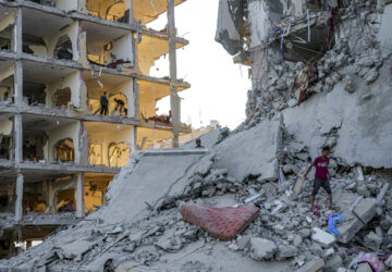 FILE - Palestinians inspect their houses after Israeli bombardment on Deir al-Balah, Thursday, Aug. 29, 2024. (AP Photo/Abdel Kareem Hana, File)