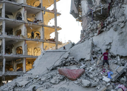 FILE - Palestinians inspect their houses after Israeli bombardment on Deir al-Balah, Thursday, Aug. 29, 2024. (AP Photo/Abdel Kareem Hana, File)