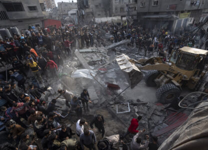 FILE - Palestinians search for bodies and survivors in the rubble of a residential building destroyed in an Israeli airstrike, in Rafah southern Gaza Strip, Wednesday, Dec. 20, 2023. (AP Photo/Fatima Shbair, File)