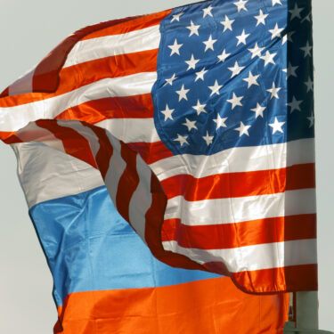 FILE - U.S. and Russian national flags wave on the wind in Moscow's Vnukovo airport, Russia, April 11, 2017 to welcome a U.S. dignitary. (AP Photo/ Ivan Sekretarev, file)