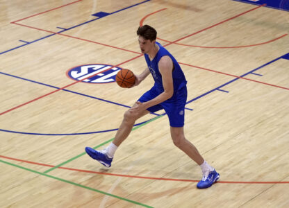 Olivier Rioux, 7-foot-9 NCAA college basketball player at Florida, moves the ball downcourt at the team's practice, Friday, Oct. 18, 2024, in Gainesville, Fla. (AP Photo/John Raoux)