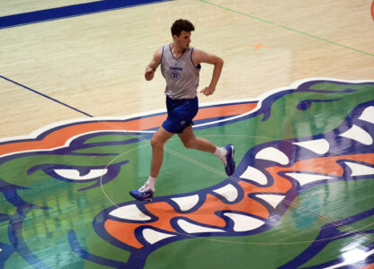 Olivier Rioux, 7-foot-9 NCAA college basketball player at Florida, runs the court at the team's practice, Friday, Oct. 18, 2024, in Gainesville, Fla. (AP Photo/John Raoux)