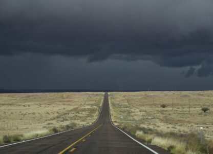 Storm clouds form on Highway 264, on the Navajo Nation, on the outskirts of Tuba City, Ariz., Friday, Oct. 18, 2024. Soaring unemployment and poverty has pushed young Navajos to leave their sacred lands in search of jobs. (AP Photo/Rodrigo Abd)