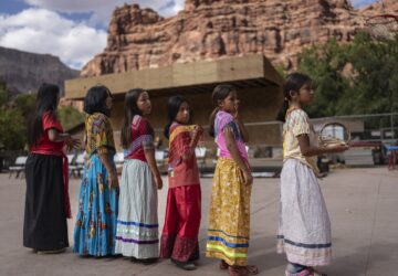 Young Havasupai dancers prepare to perform a traditional dance welcoming Democratic Senate candidate Ruben Gallego, in Supai, Ariz., Monday, Oct. 14, 2024. Gallego hoped to connect with voters in the Havasupai reservation, which has only 156 registered voters, to fulfill a campaign pledge to visit all the Native American tribes in Arizona. (AP Photo/Rodrigo Abd)