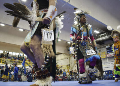 Kenneth Deputee Sr. with the Crow Indian Tribe participates in the grand entrance for a powwow at Montana State University Billings in Billings, Mont., on April 6, 2024. (AP Photo/Matthew Brown)