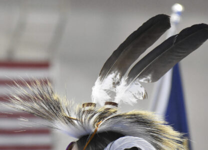 Eagle feathers adorn a headdress during a powwow in Montana, on April 6, 2024. (AP Photo/Matthew Brown)