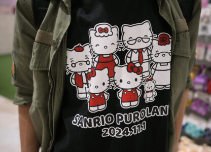 A Hello Kitty fan shows off his t-shirt showing Kitty's family members while visiting Sanrio Puroland to celebrate its best known character's 50th birth anniversary, in Tama, a western suburb of Tokyo, Japan, Friday, Nov. 1, 2024. (AP Photo/Hiro Komae)