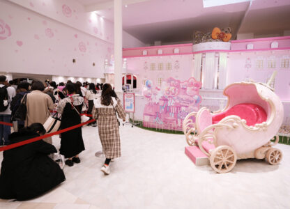 Hello Kitty fans wait in line before meeting to greet her and having their photos taken with her during her 50th birth anniversary at Sanrio Puroland in Tama, a western suburb of Tokyo, Japan, Friday, Nov. 1, 2024. (AP Photo/Hiro Komae)