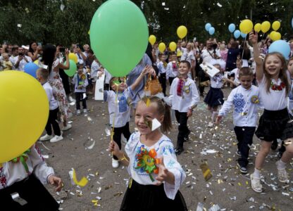 First-graders at Gymnasium No. 6 attend a traditional back-to-school ceremony in Zaporizhzhia, Ukraine, Sept. 1, 2024. (AP Photo/Evgeniy Maloletka)