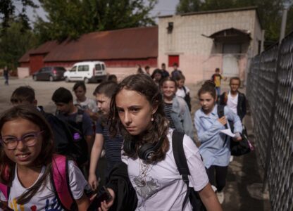 Children go to the school basement to continue their studies during an air alert in Zaporizhzhia, Ukraine, Sept. 3, 2024. (AP Photo/Evgeniy Maloletka)