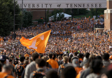 FILE - Tennessee fans gather outside Neyland Stadium before an NCAA college football game between Tennessee and Kent State in Knoxville, Tenn., Sept. 14, 2024. (AP Photo/George Walker IV, File)