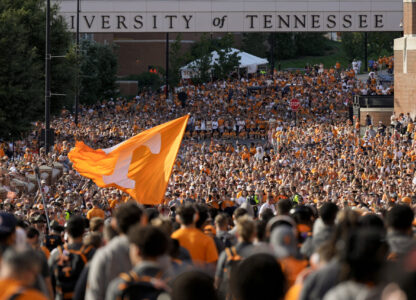 FILE - Tennessee fans gather outside Neyland Stadium before an NCAA college football game between Tennessee and Kent State in Knoxville, Tenn., Sept. 14, 2024. (AP Photo/George Walker IV, File)