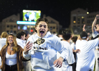 FILE - Colorado fans storm the playing field after Colorado's overtime victory over Baylor in an NCAA college football game Saturday, Sept. 21, 2024, in Boulder, Colo. (AP Photo/David Zalubowski, File)