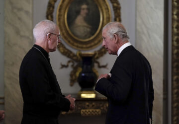 FILE - Britain's King Charles III speaks to Archbishop of Canterbury, Justin Welby, as he meets with faith leaders during a reception at Buckingham Palace, London, Friday Sept. 16, 2022. (Aaron Chown/Pool Photo via AP, File)