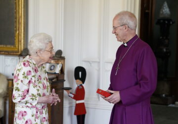 FILE - Britain's Queen Elizabeth II receives the Archbishop of Canterbury Justin Welby at Windsor Castle, Windsor, England, Tuesday June 21, 2022, where he presented the Queen with a special 'Canterbury Cross' for her unstinting service to the Church of England over seventy years and a citation for the Cross, which was presented as a framed piece of calligraphy. (Andrew Matthews/Pool via AP, File)