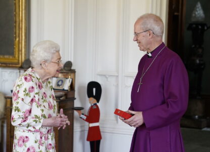 FILE - Britain's Queen Elizabeth II receives the Archbishop of Canterbury Justin Welby at Windsor Castle, Windsor, England, Tuesday June 21, 2022, where he presented the Queen with a special 'Canterbury Cross' for her unstinting service to the Church of England over seventy years and a citation for the Cross, which was presented as a framed piece of calligraphy. (Andrew Matthews/Pool via AP, File)