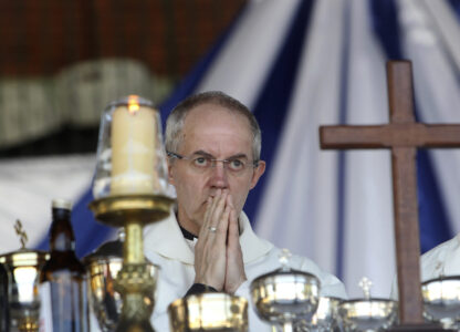 FILE - Britain's Archbishop of Canterbury, Justin Welby conducts a church service with Anglicans in Harare, Zimbabwe, Sunday, April, 17, 2016. (AP Photo/Tsvangirayi Mukwazhi, File)