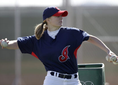 FILE - Justine Siegal throws during batting practice to Cleveland Indians minor leaguers during spring training, Feb. 21, 2011, in Goodyear, Ariz. (AP Photo/Mark Duncan, File)