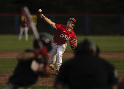 Allison Schroder #16 of Team Canada pitches during a WBSC Women's Baseball World Cup exhibition game against Team USA at Baseball Central on Friday, July 26, 2024 in Thunder Bay, Ontario. (Jean Fruth via AP)