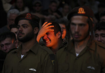 Mourners react during eulogies for Israeli soldier Capt. Itay Marcovich, who was killed in action in Lebanon, during his funeral in Kokhav Yair, Israel, Thursday, Nov. 14, 2024. (AP Photo/Ohad Zwigenberg)