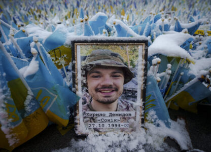 Snow coats the photograph of a fallen Ukrainian serviceman in Independence Square in Kyiv, Ukraine Tuesday, March 12, 2024. (AP Photo/Vadim Ghirda)