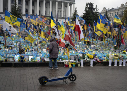 A woman looks at the memorial to fallen soldiers in Independence Square in Kyiv, Ukraine, Friday, Nov. 15, 2024. (AP Photo/Efrem Lukatsky)