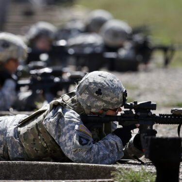 FILE - Female soldiers from 1st Brigade Combat Team, 101st Airborne Division train on a firing range while testing new body armor in Fort Campbell, Ky., Sept. 18, 2012. (AP Photo/Mark Humphrey, File)