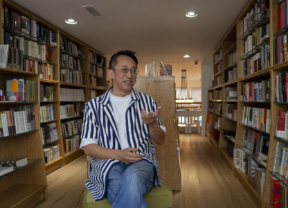 Yu Miao, owner of JF Books, speaks to The Associated Press in his bookstore in Washington, Thursday, Oct. 3, 2024. (AP Photo/Ben Curtis)