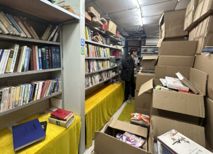 Boxes filled with books are seen inside the shuttered secondhand bookstore Wang Pangzi in Ningbo, in eastern China's Zhejiang province, Oct. 9, 2024. (AP Photo/Dake Kang)