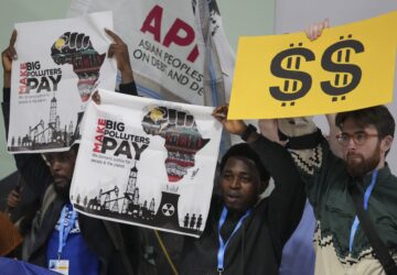 Activists participate in a demonstration for climate finance at the COP29 U.N. Climate Summit, Tuesday, Nov. 19, 2024, in Baku, Azerbaijan. (AP Photo/Sergei Grits)