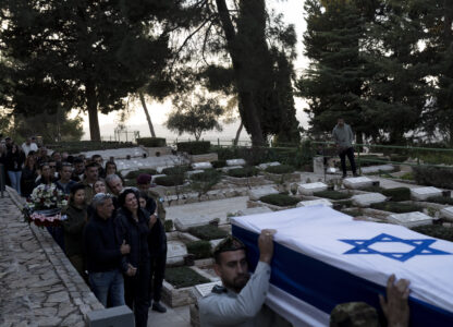 The family of Israeli Defense Forces Sgt. First Class (res.) Roi Sasson, who was killed in action in the Gaza Strip, walk behind his coffin during his funeral at Mt. Herzl military cemetery in Jerusalem, Wednesday, Nov. 20, 2024. (AP Photo/Maya Alleruzzo)