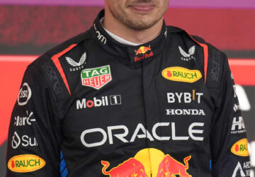 Red Bull driver Max Verstappen of the Netherlands smiles on the podium after winning the Brazilian Formula One Grand Prix at the Interlagos race track in Sao Paulo, Sunday, Nov. 3, 2024. (AP Photo/Andre Penner)
