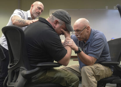Border Patrol specialist Mitchell Holmes, right, and Fish and Wildlife Regional Law Enforcement agent Kevin Shinn, use skills they learned in the Border Patrol Chaplaincy academy during a training session, Wednesday, Nov. 20, 2024, in Dania Beach, Fla. (AP Photo/Marta Lavandier)