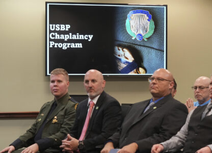 The USBP chaplaincy program class listen to remarks during their graduation, Thursday, Nov. 21, 2024, in Dania Beach, Fla. (AP Photo/Marta Lavandier)
