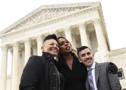 FILE - Sara Ramirez, from left, Laverne Cox and Chase Strangio, an attorney with the American Civil Liberties Union, pose for a photo outside the Supreme Court in Washington, Oct. 8, 2019. (AP Photo/Susan Walsh, File)