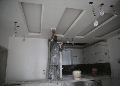 A man works inside a luxury house in the city of Kabul, Afghanistan, Sept. 23, 2024. (AP Photo/Siddiqullah Alizai)