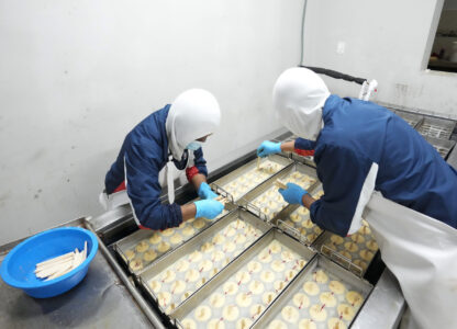 Workers prepare popsicles at an artisanal factory in Salcedo, Ecuador, Thursday, Nov. 28, 2024, amid a wave of power outages, triggered by a prolonged dry spell. (AP Photo/Dolores Ochoa)