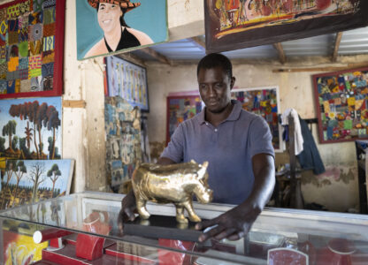 Jeweller Moussa Diop presents a bronze hippopotamus in his workshop, as part of the rebondir exhibition at the Dakar 2024 biennial Off in Dakar, Senegal, Thursday, Nov. 28, 2024. (AP Photo/Sylvain Cherkaoui)