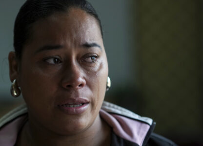 Larissa Martinez, who was deported from the U.S. in 2021 with her three children, reacts during an interview in San Pedro Sula, Honduras, Wednesday, Dec. 4, 2024. (AP Photo/Moises Castillo)